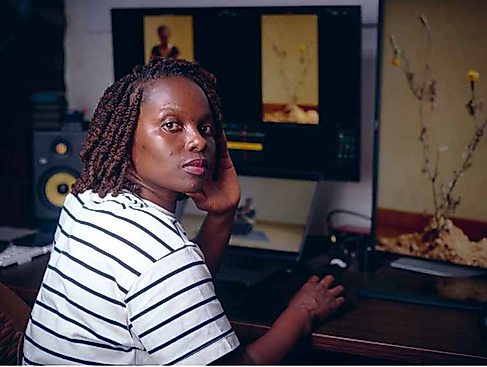 Rehema Chachage editing her films for the exhibition Amani kukita | kung'oa